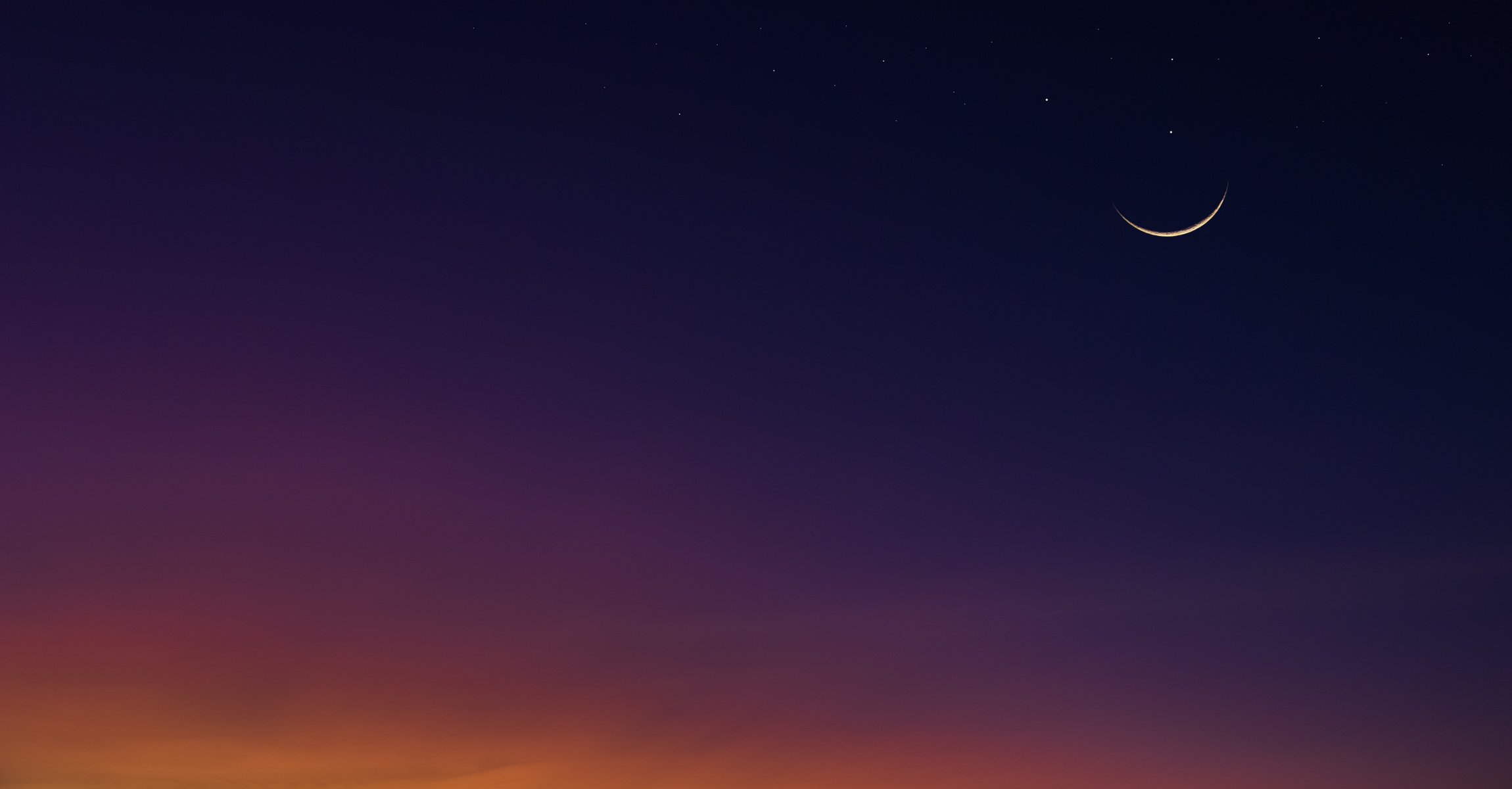 Crescent moon on dusk sky